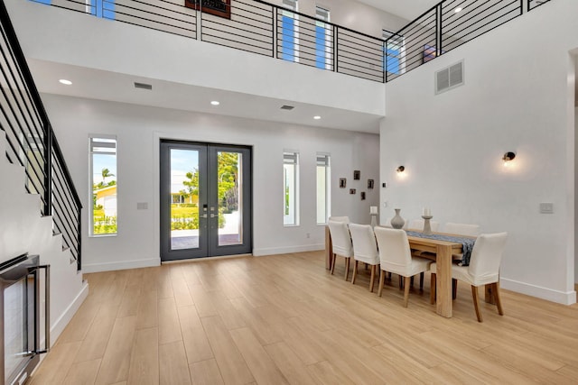 12952 Drayton Rd, North Palm Beach, FL 33408 - dining area featuring light wood finished floors, baseboards, french doors, and visible vents