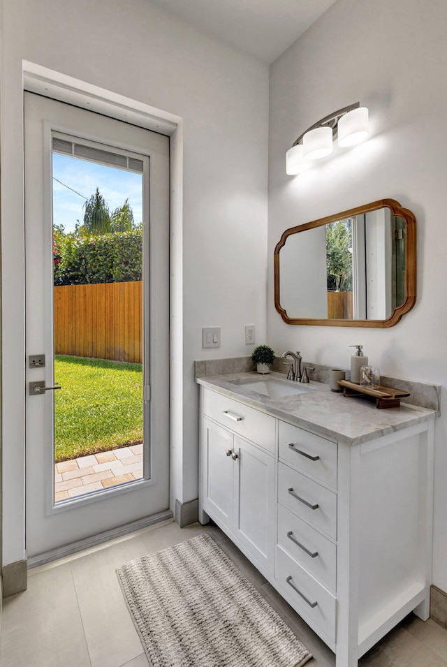 12952 Drayton Rd, North Palm Beach, FL 33408 - bathroom with vanity and tile patterned flooring