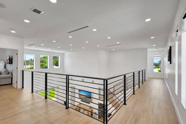 12952 Drayton Rd, North Palm Beach, FL 33408 - hall with light wood-style floors, visible vents, baseboards, and recessed lighting