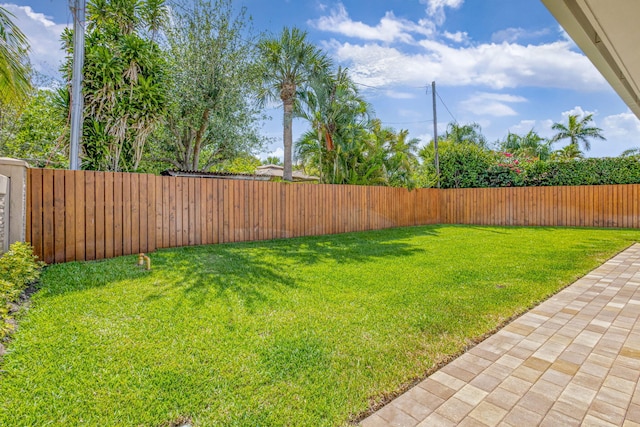 12952 Drayton Rd, North Palm Beach, FL 33408 - view of yard featuring a fenced backyard