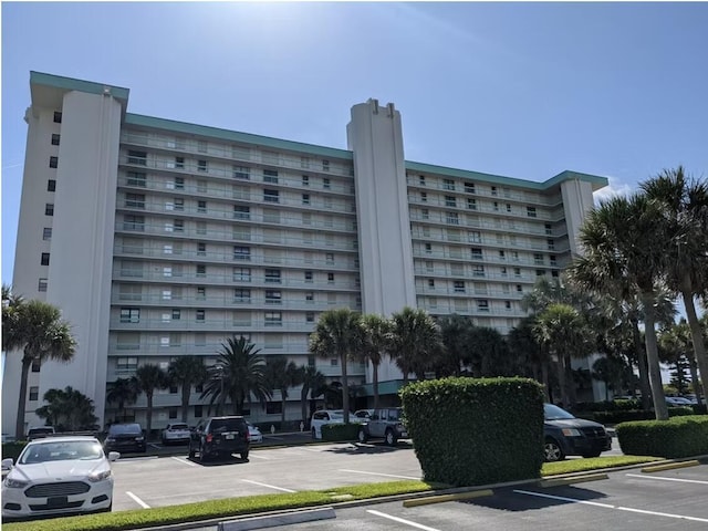 9940 S Ocean Dr Unit 1005, Jensen Beach, FL 34957 - view of apartment building / complex with uncovered parking