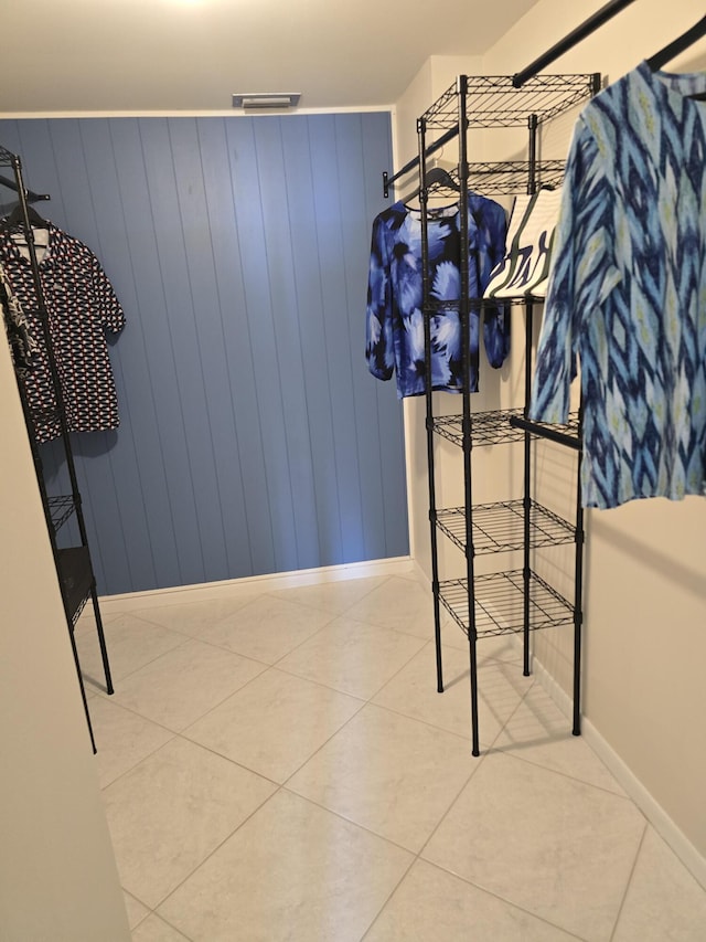 interior space featuring tile patterned flooring and visible vents