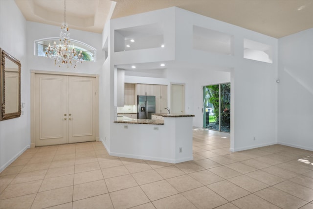 4065 Manchester Lake Dr, Lake Worth, FL 33449 - foyer with light tile patterned flooring, a chandelier, baseboards, a towering ceiling, and recessed lighting