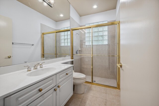 4065 Manchester Lake Dr, Lake Worth, FL 33449 - full bath featuring tile patterned flooring, a shower stall, toilet, and vanity