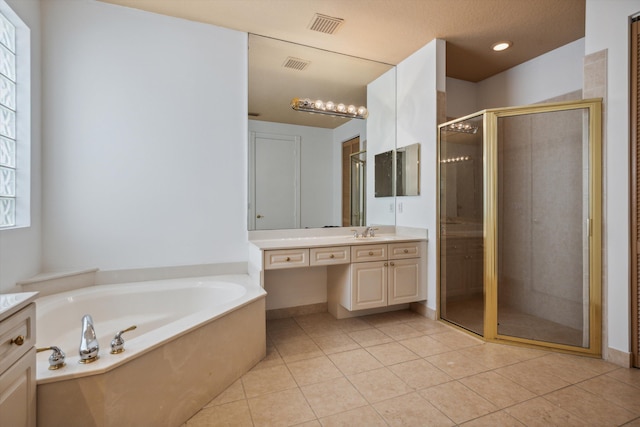 4065 Manchester Lake Dr, Lake Worth, FL 33449 - full bathroom with a stall shower, vanity, a garden tub, and tile patterned flooring