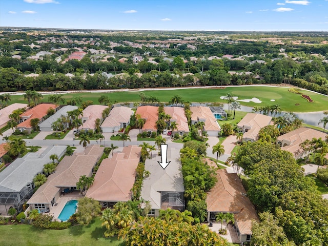 4065 Manchester Lake Dr, Lake Worth, FL 33449 - aerial view of residential area with a golf course, a nearby body of water, and a pool area