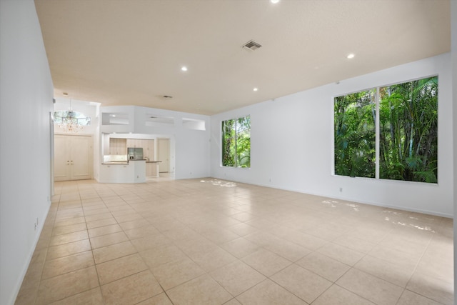 4065 Manchester Lake Dr, Lake Worth, FL 33449 - unfurnished living room featuring light tile patterned floors, recessed lighting, and a chandelier