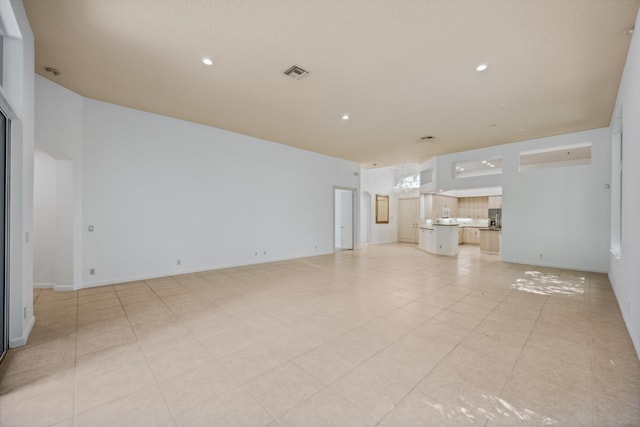 4065 Manchester Lake Dr, Lake Worth, FL 33449 - unfurnished living room featuring recessed lighting and light tile patterned floors