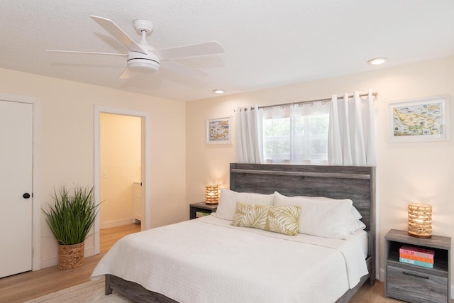 bedroom featuring ensuite bathroom, wood finished floors, ceiling fan, and recessed lighting
