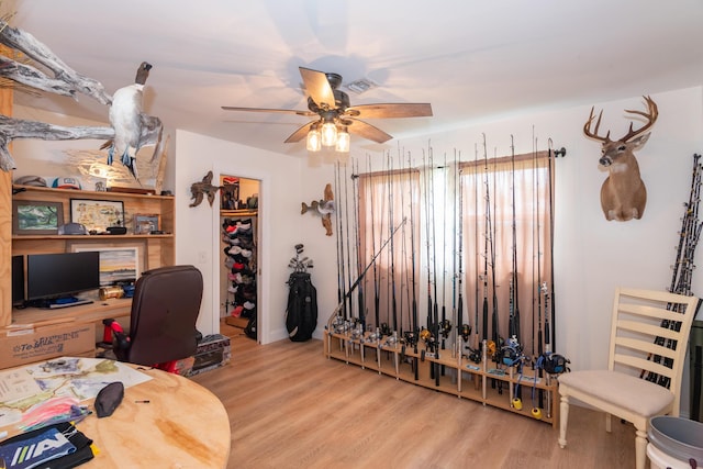 home office featuring a ceiling fan and wood finished floors