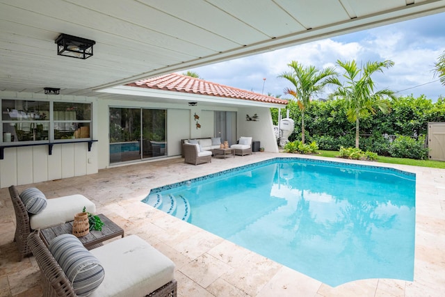 pool featuring an outdoor hangout area and a patio area