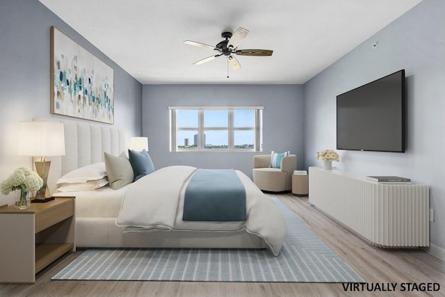 2640 Lake Shore Dr Unit 614, Riviera Beach, FL 33404 - bedroom featuring wood finished floors and ceiling fan