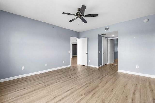 2640 Lake Shore Dr Unit 614, Riviera Beach, FL 33404 - unfurnished bedroom with light wood-style flooring, baseboards, and ceiling fan