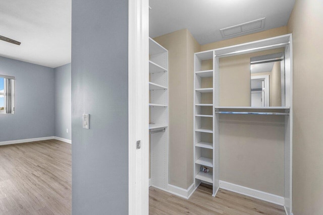 2640 Lake Shore Dr Unit 614, Riviera Beach, FL 33404 - walk in closet with wood finished floors