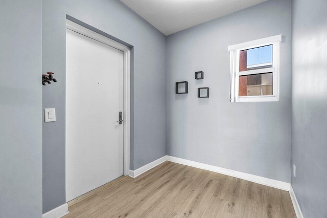 2640 Lake Shore Dr Unit 614, Riviera Beach, FL 33404 - entryway featuring light wood-type flooring and baseboards
