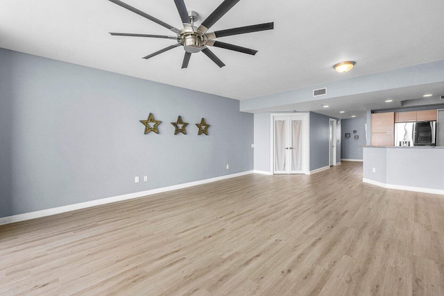 2640 Lake Shore Dr Unit 614, Riviera Beach, FL 33404 - unfurnished living room featuring light wood finished floors, a ceiling fan, baseboards, and recessed lighting