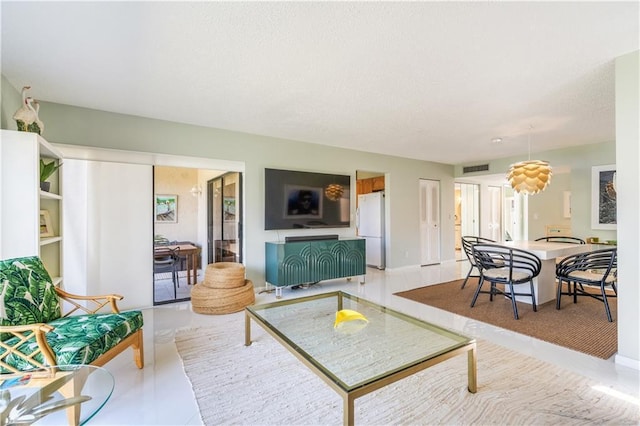 3215 S Lakeview Cir Unit 12104, Hutchinson Island, FL 34949 - living area featuring light tile patterned flooring