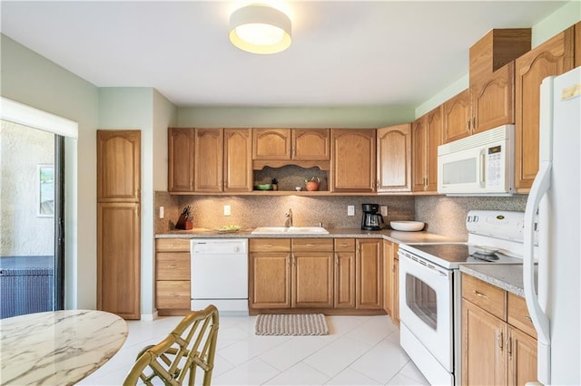 3215 S Lakeview Cir Unit 12104, Hutchinson Island, FL 34949 - kitchen featuring white appliances, a sink, backsplash, open shelves, and light tile patterned floors