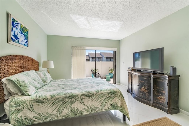 3215 S Lakeview Cir Unit 12104, Hutchinson Island, FL 34949 - bedroom featuring access to outside and a textured ceiling