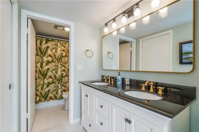 3215 S Lakeview Cir Unit 12104, Hutchinson Island, FL 34949 - full bath featuring toilet, double vanity, a shower with shower curtain, and baseboards