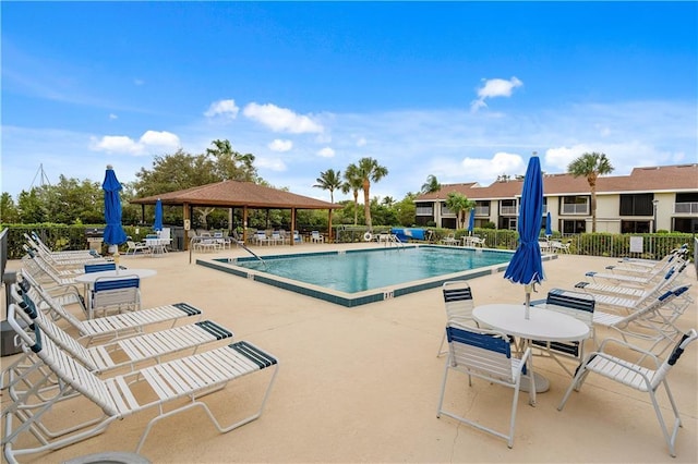 3215 S Lakeview Cir Unit 12104, Hutchinson Island, FL 34949 - community pool with a gazebo, a patio, and fence
