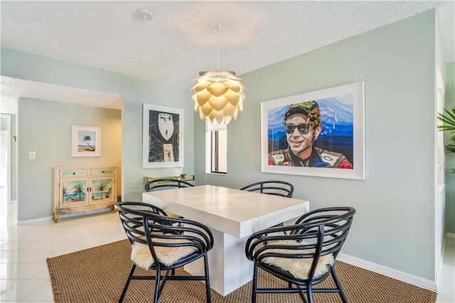 3215 S Lakeview Cir Unit 12104, Hutchinson Island, FL 34949 - dining space with a textured ceiling and baseboards
