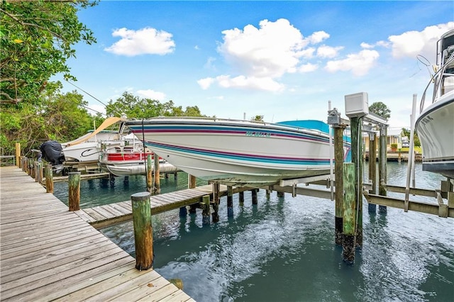 3215 S Lakeview Cir Unit 12104, Hutchinson Island, FL 34949 - dock area featuring boat lift and a water view