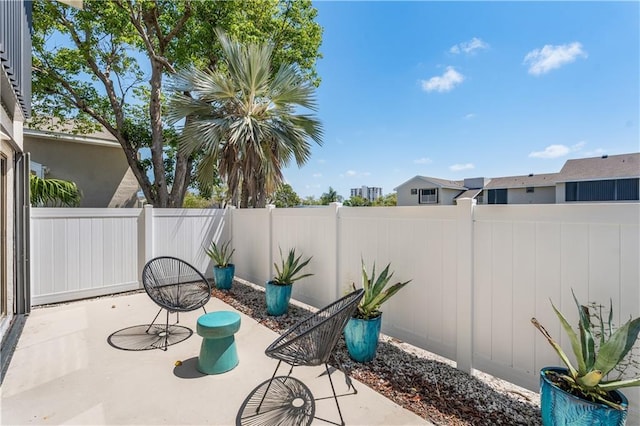 3215 S Lakeview Cir Unit 12104, Hutchinson Island, FL 34949 - view of patio / terrace featuring a fenced backyard