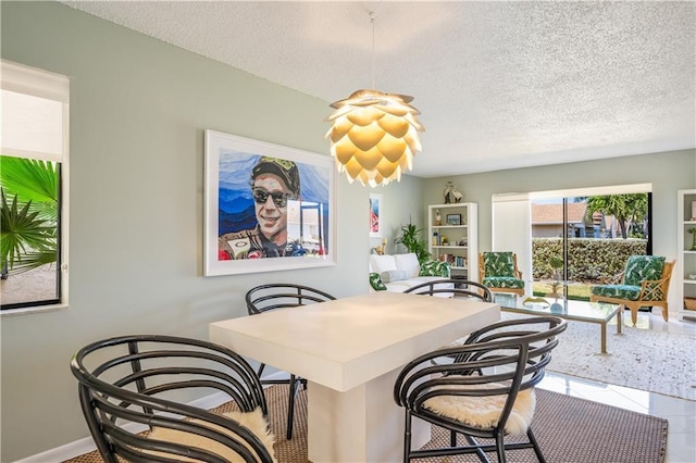 3215 S Lakeview Cir Unit 12104, Hutchinson Island, FL 34949 - dining space featuring a textured ceiling