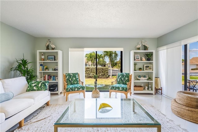 3215 S Lakeview Cir Unit 12104, Hutchinson Island, FL 34949 - living area with plenty of natural light and a textured ceiling