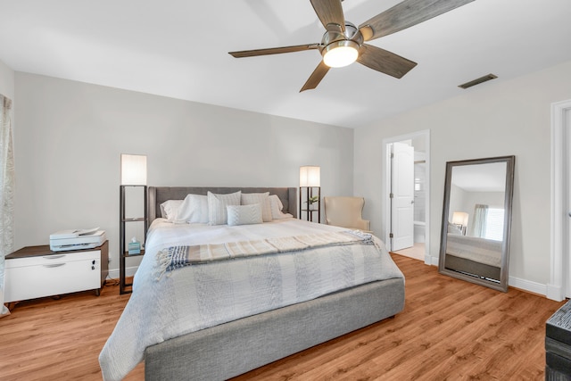 bedroom with light wood-style flooring, baseboards, and a ceiling fan