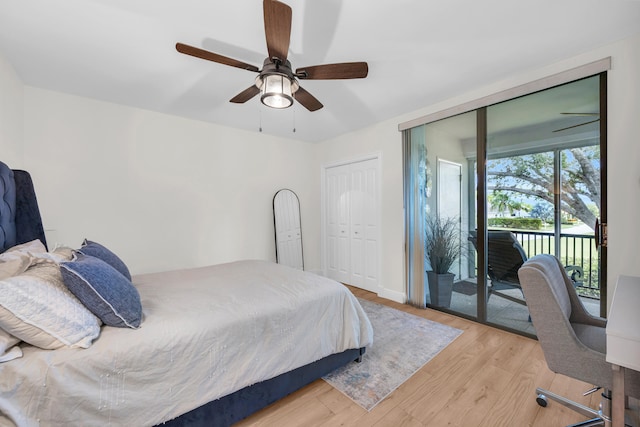 bedroom with access to outside, light wood finished floors, and a ceiling fan
