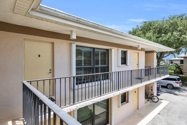 property entrance featuring stucco siding