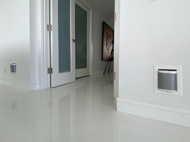 2800 S Ocean Blvd Unit 14A, Boca Raton, FL 33432 - hall with light tile patterned floors and baseboards