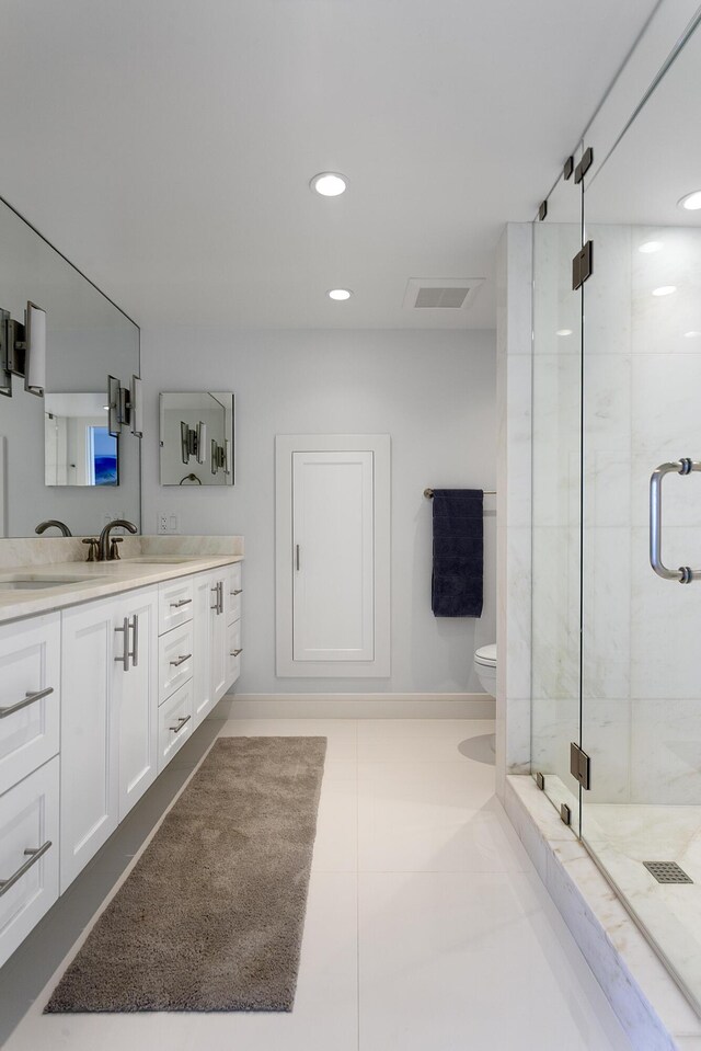 2800 S Ocean Blvd Unit 14A, Boca Raton, FL 33432 - bathroom featuring tile patterned floors, vanity, baseboards, and a stall shower