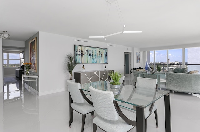 2800 S Ocean Blvd Unit 14A, Boca Raton, FL 33432 - dining area with tile patterned flooring and baseboards