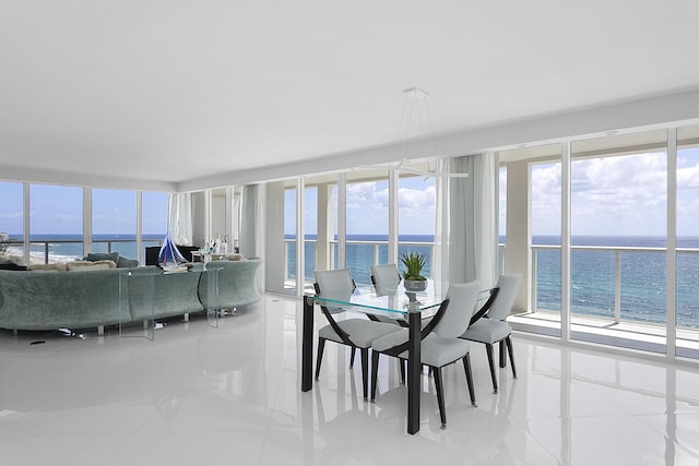 2800 S Ocean Blvd Unit 14A, Boca Raton, FL 33432 - dining space with a water view and tile patterned flooring