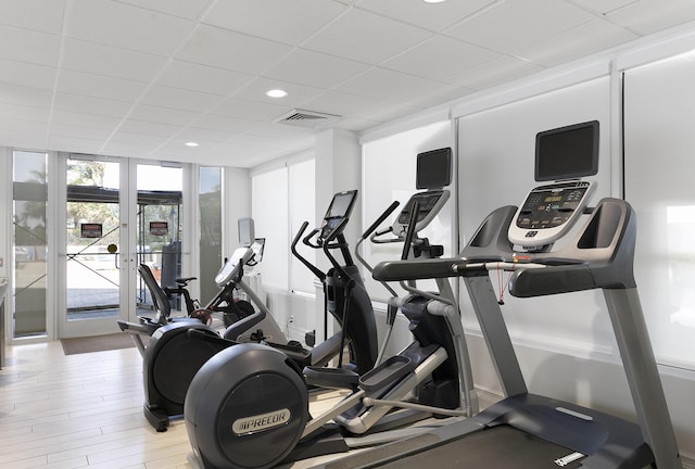 2800 S Ocean Blvd Unit 14A, Boca Raton, FL 33432 - workout area with a drop ceiling, french doors, visible vents, a wall of windows, and wood finished floors