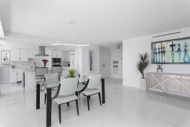 2800 S Ocean Blvd Unit 14A, Boca Raton, FL 33432 - dining space with light tile patterned floors and baseboards