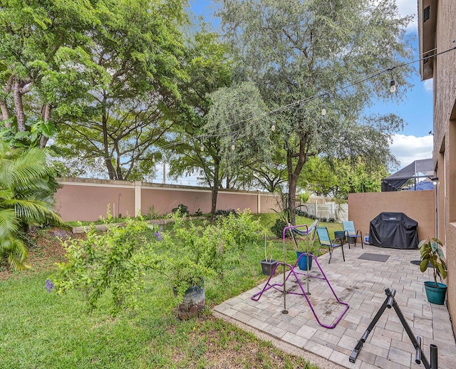 fenced backyard featuring a patio