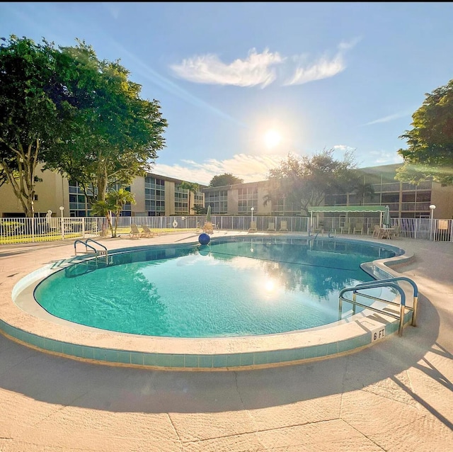 community pool featuring fence