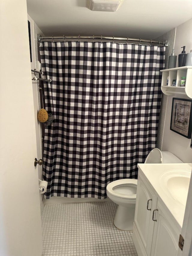 full bath with toilet, tile patterned floors, vanity, and a shower with shower curtain