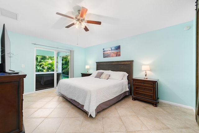 bedroom with baseboards, a ceiling fan, light tile patterned flooring, and access to exterior