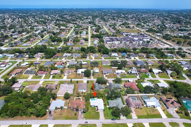 aerial view of property's location with nearby suburban area