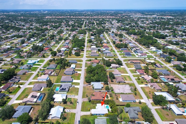 aerial view of property's location with nearby suburban area