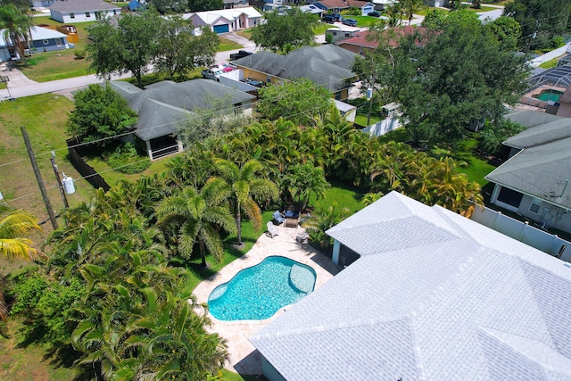 aerial view of residential area featuring a pool