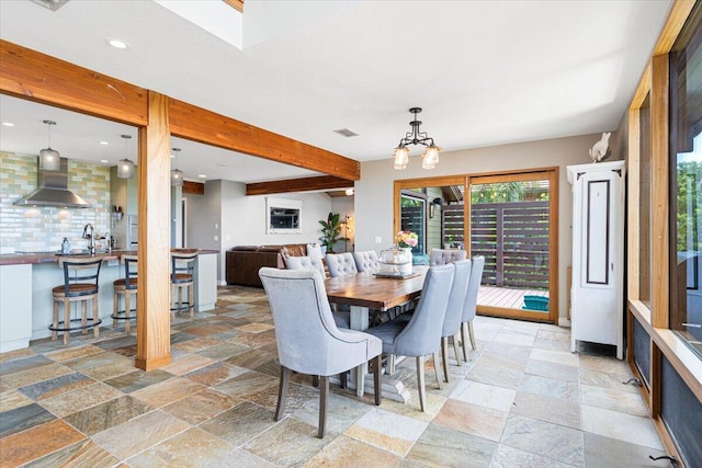 3781 NE Sugarhill Ave, Jensen Beach, FL 34957 - living area featuring baseboards, wooden ceiling, ceiling fan, and vaulted ceiling with beams