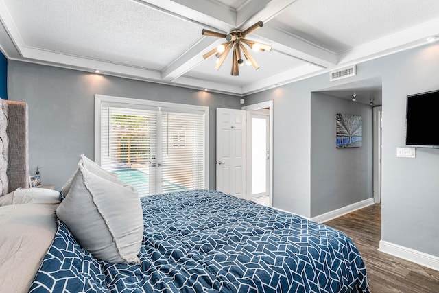 1707 NW 38th St, Oakland Park, FL 33309 - bedroom featuring baseboards, beamed ceiling, visible vents, and wood finished floors
