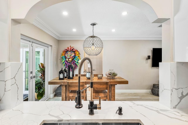 1707 NW 38th St, Oakland Park, FL 33309 - room details featuring a sink, crown molding, light stone countertops, and arched walkways