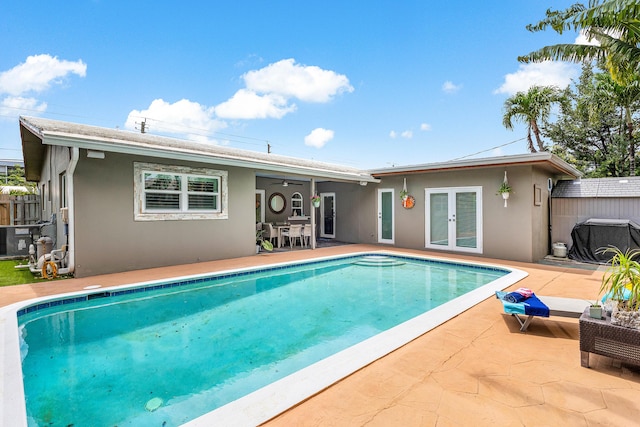 1707 NW 38th St, Oakland Park, FL 33309 - rear view of house featuring french doors, stucco siding, and a patio